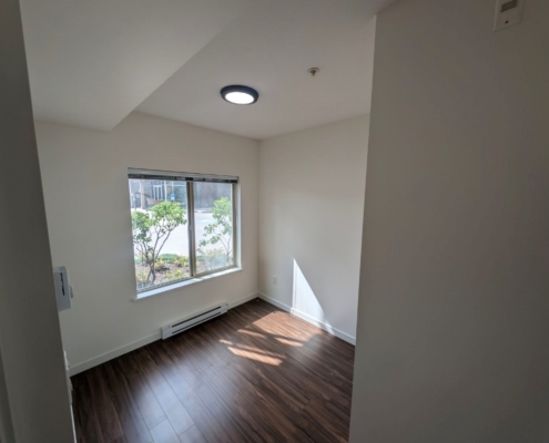 New wall, baseboard and ceiling paint, new LED ceiling dome light in apartment bedroom.