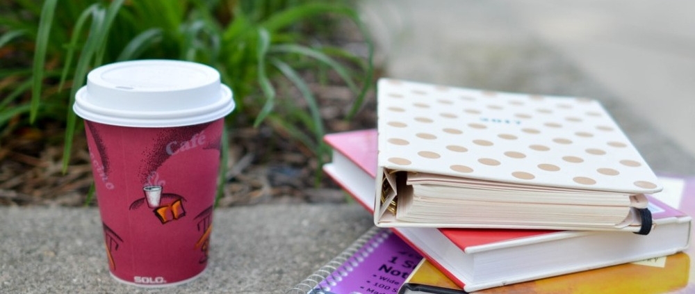 Textbooks and coffee of university student